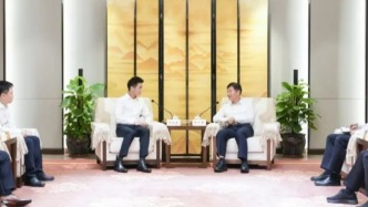 海南省省長劉小明會見何猷君