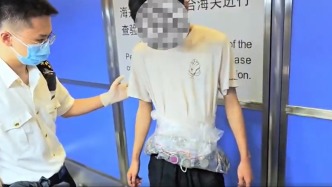 一名旅客腰間綁藏265枚銀元進境被查，自述用于出售牟利