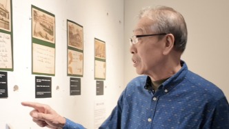 法國小伙在東京展出日軍侵華歷史照片，日籍八路軍老戰(zhàn)士之子觀展