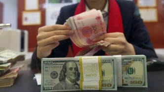 離岸、在岸人民幣對美元匯率分別升破7.02、7.03