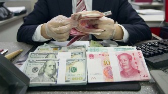 今年首个交易日延续升势：人民币对美元即期汇率升破6.98