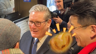 英國首相現(xiàn)身上海，“種草”蝴蝶酥