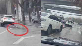武漢一路面被指有“馬路刺客”常有車輛托底，城管局：正計(jì)劃調(diào)整