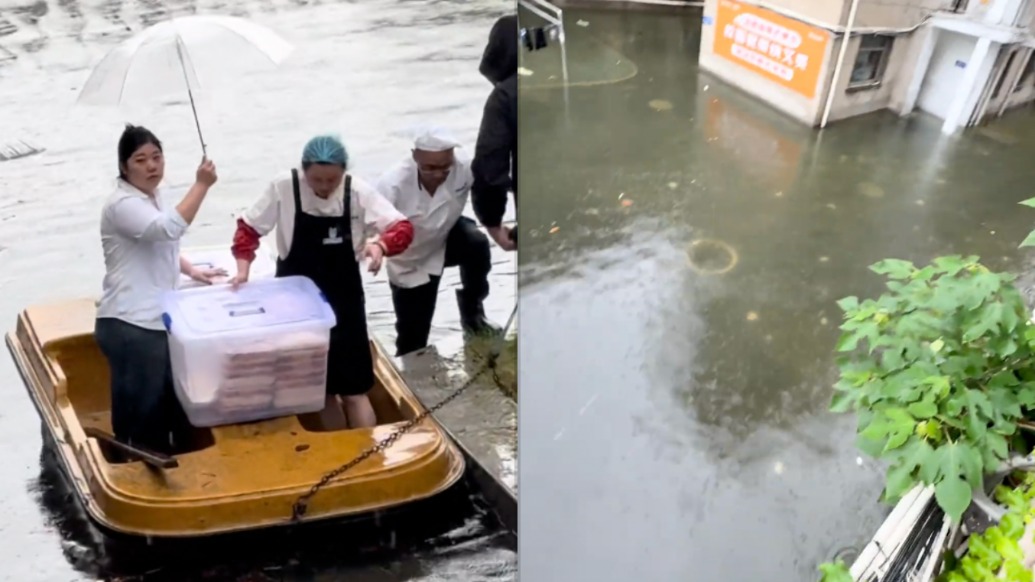 荆州强降雨致一高校积水严重，后勤工作人员乘船为学生送餐