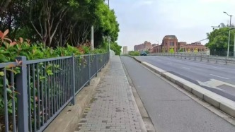 电线杆占据人行道“C位”，如何还路于民？