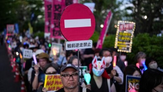 人民日报钟声：急修“安保三文件”，暴露日本加速军事转轨的急躁姿态