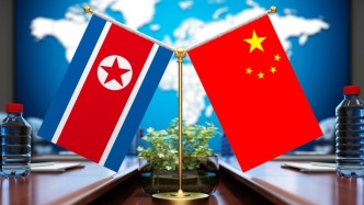 习近平同金正恩就《中朝友好合作互助条约》签订65周年互致贺电