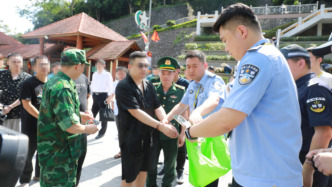 一名涉嫌破坏计算机信息系统犯罪嫌疑人被押解回国
