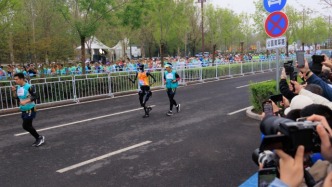 全国马拉松接连开赛，“人机共跑”激活春日“赛事热”