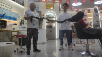 重慶40歲女子蓄發28年長2.52米