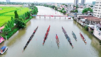 开平市端午龙舟活动周“一龙舟一桌饭一家人”三大主题赋能“百千万工程”