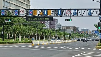 道路隔离栏有了“变形金刚”！上海首套潮汐智能移动护栏落地金科路