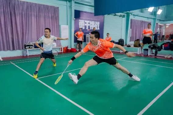 Athletes in action on the field during a community sports event.